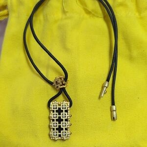 18k Fibula Diamond jewelry necklace with diamond chips and rubies as well.